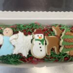Holiday christmas cookies one angel one snowflake one snowman one reindeer and a Christmas tree