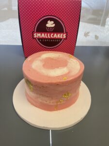 pink cake with gold