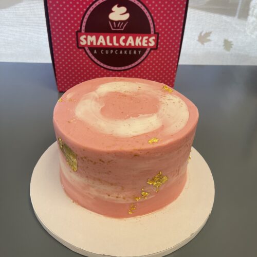 pink cake with gold