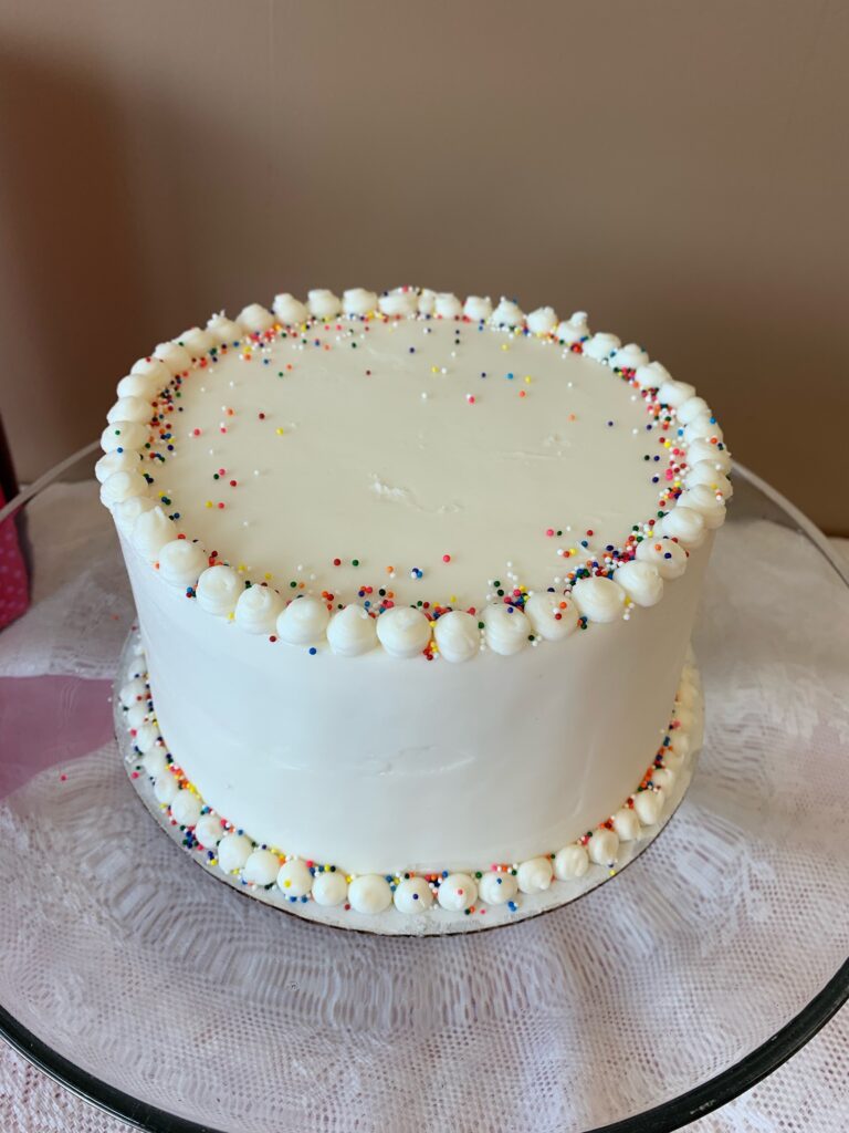 white cake with rainbow sprinkles